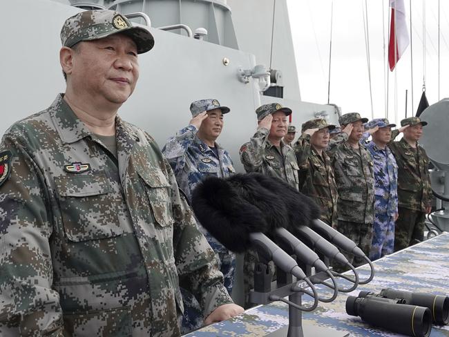 FILE - In this April 12, 2018, file photo released by Xinhua News Agency, Chinese President Xi Jinping speaks after reviewing the Chinese People's Liberation Army (PLA) Navy fleet in the South China Sea. A new Pentagon report lays out U.S. concerns about China's growing military might, underscoring worries about a possible attack against Taiwan. The report's release on Jan. 15, 2019 came just a week after Chinese President Xi Jinping called on his People's Liberation Army to better prepare for combat. (Li Gang/Xinhua via AP, File)