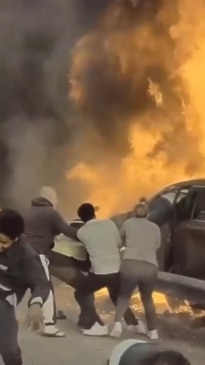 Good samaritans rush to pull man from burning car