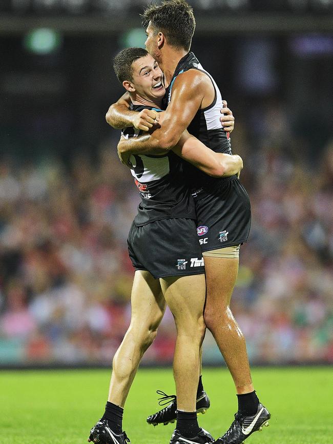 Riley Bonner of the Power celebrates kicking a goal with Darcy Byrne-Jones. Picture: Brett Hemmings/AFL Media/Getty Images