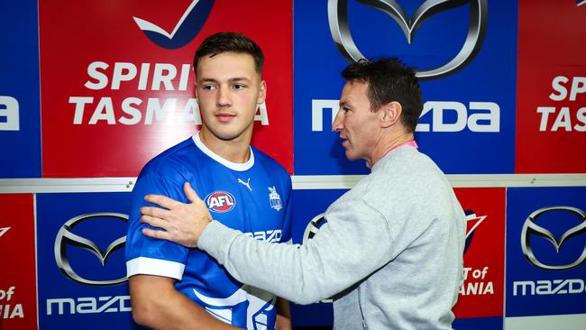 Cooper Harvey with dad Brent before his North Melbourne debut. Picture: Dylan Burns/AFL Photos via Getty Images