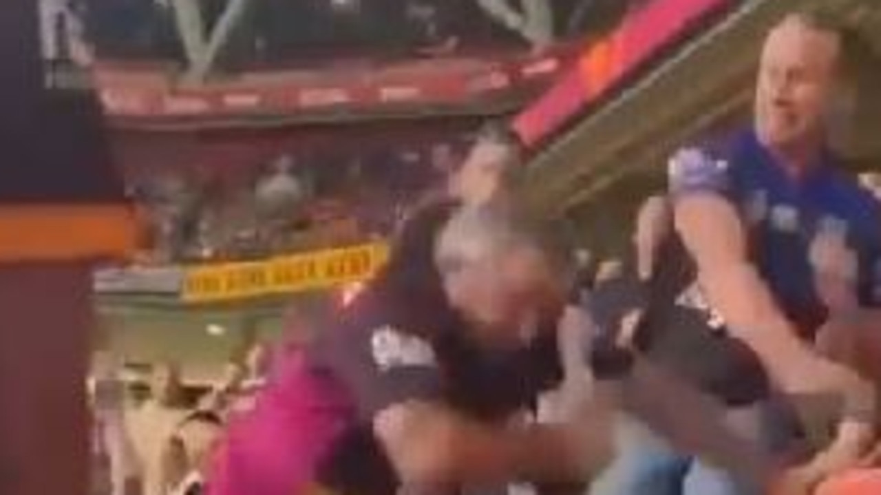 A fight breaks out at Suncorp Stadium last night between a Broncos fan and a Bulldogs fan.