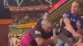 A fight breaks out at Suncorp Stadium last night between a Broncos fan and a Bulldogs fan.