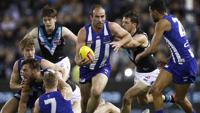 Ben Cunnington finds a way out of traffic against Port last weekend. Picture: AAP Image/Daniel Pockett