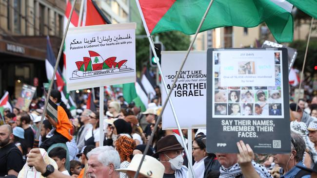 SYDNEY, AUSTRALIA - NewsWire Photos OCTOBER 6, 2024: Protestors march on the streets of the Sydney CBD. Protestors gather at Hyde Park in Sydney's CBD to demand an end to the ongoing war and Israel's current occupation of Gaza, and the escalating Israel-Lebanon conflict.Picture: NewsWire / Damian Shaw