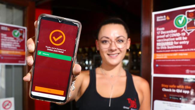 Bar manager at The Jack hotel Kirilea Gray shows proof of vaccination on the Check In Qld app. Picture: Brendan Radke