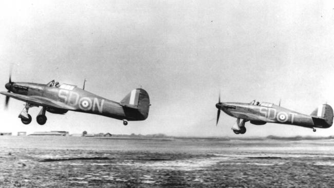 Hurricane fighters taking off from RAF Hawkinge, front-line fighter base in Kent, England, to intercept enemy aircraft during Battle of Britain in 1940.