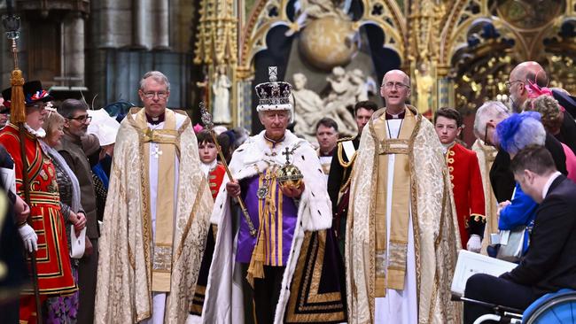 King Charles III wearing the Imperial State Crown and carrying the Sovereign's Orb and Sceptre leaves Westminster Abbey. Picture: Getty Images