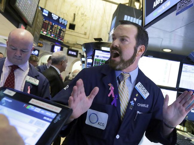 Specialist Charles Boeddinghaus works with traders at the post that handles Allergan, on the floor of the New York Stock Exchange, Wednesday, April 6, 2016. The biggest U.S.-based drugmaker, Pfizer Inc., will stay put thanks to aggressive new Treasury Department rules that succeeded in blocking Pfizer from acquiring rival Allergan and moving to Ireland â€” at least on paper â€” to reduce its tax bill. (AP Photo/Richard Drew)