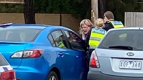 Anti-masker Mandy Crerar as she was being arrested outside a Frankston cafe.