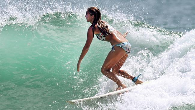 Surfers scramble for waves at Snapper Rocks as the swell drops. Pic by Luke Marsden.