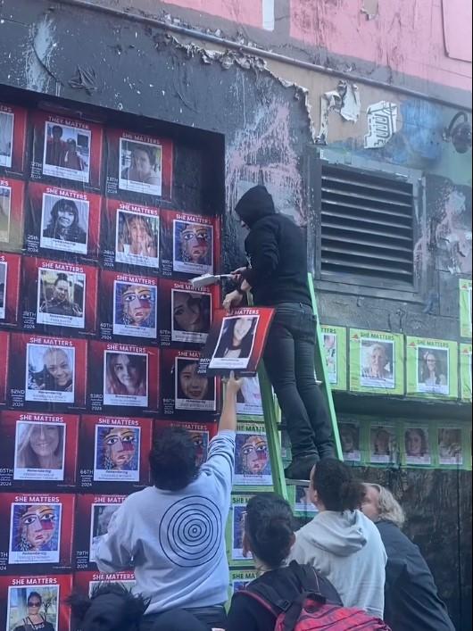 Volunteers helped repair the mural on Saturday morning. Picture: Supplied