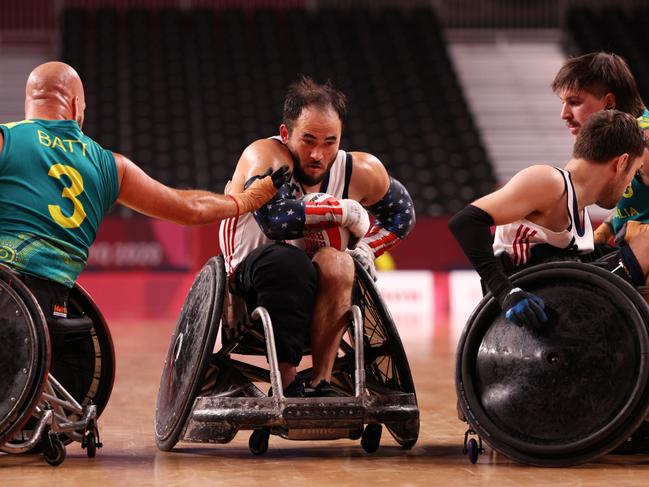 Charles Aoki of Team United States breaks a tackle during the Wheelchair Rugby semi final between Team United States and Team Australia at the Tokyo 2020 Paralympic Games. Picture: Adam Pretty/Getty Images