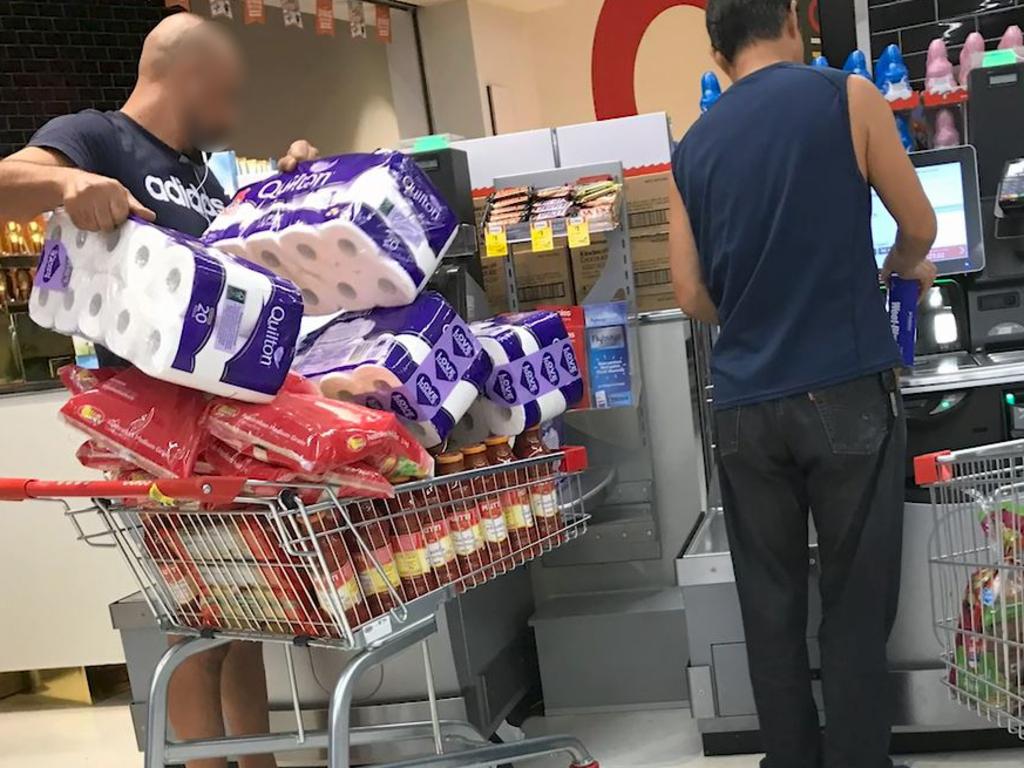 A customer buying a lot of toilet roll. Picture: Chan Kwok Kei / Supplied.