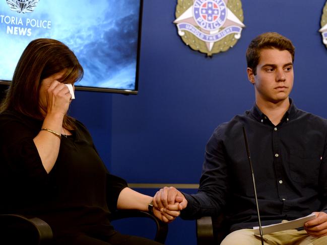 Antionetta Virgona and her son Luca (17) address the media appealing for information into the fatal shooting of their husband/father Paul Virgona on Eastlink.  Picture: Andrew Henshaw