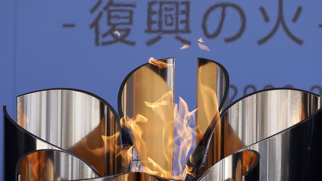 The Olympic Flame burns during the Olympic “Flame of Recovery” display ceremony in Iwaki, March 25, 2020. Picture: AP