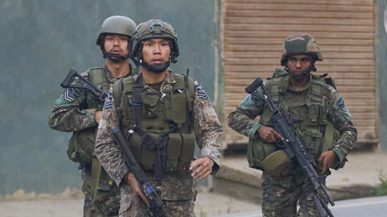 Indian air force soldiers arrive at Pampore, Pulwama district of Indian-controlled Kashmir. Picture: AP Photo/Dar Yasin