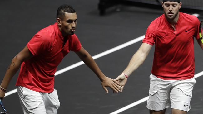 World's Nick Kyrgios, left, and Jack Sock, right, celebrate winning a point against Europe's Rafael Nadal and Tomas Berdych.