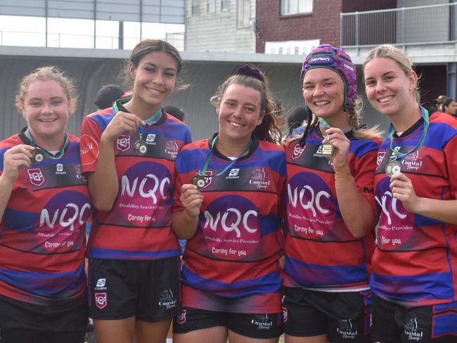 Hannah Dedauntan, Ana Malupo, Courtney Reynolds, Xanthe Topping, and Zoe Aitken celebrating Coastal Neurs' triumph at the Mackay Indigenous Rugby League Carnival. Picture: Mitch Bourke