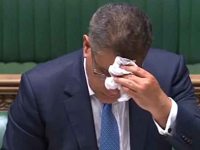 A video grab from the UK Parliament's Parliamentary Recording Unit shows Britain's Business Secretary Alok Sharma wiping his brow in the House of Commons. Picture: AFP