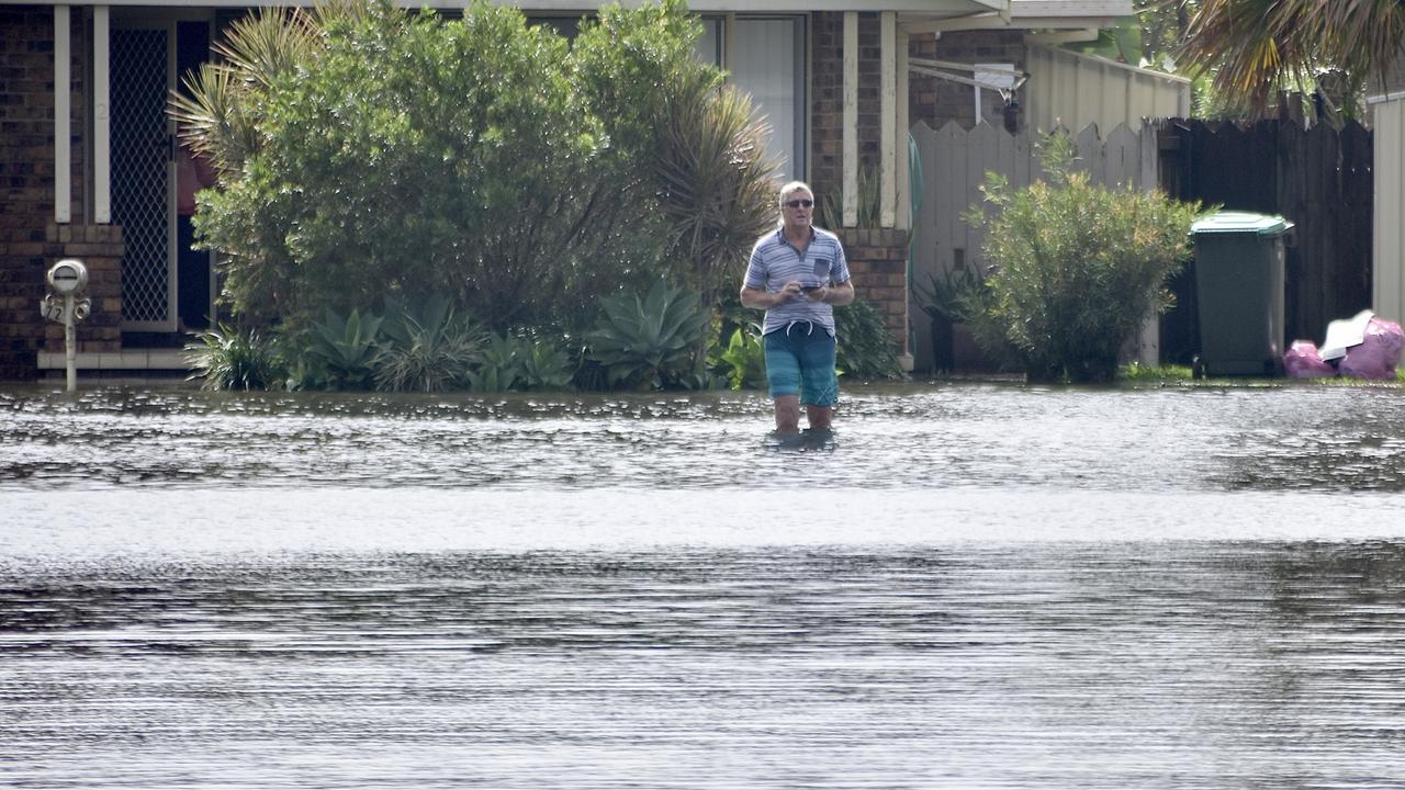 WEST BALLINA: A Ballina resident wades through floodwaters on Monday March 30, 2022. Picture: Tessa Flemming.