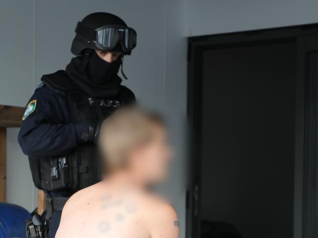 Strike Force Alaine detectives arrest a man following investigation into alleged criminal syndicate which sold drugs on the dark web. Picture: NSW Police.