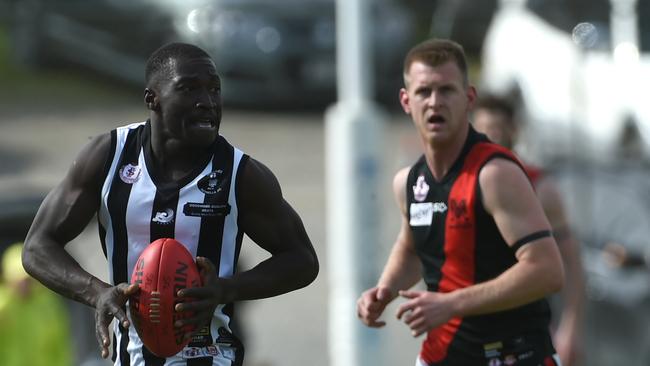 Local gun Robert Irra breaks through the middle in this year’s SFL grand final Reynella win. Picture: Tricia Watkinson