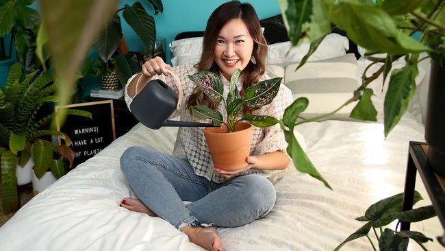 Horticulturist Tammy Huynh pictured in her home surrounded by indoor plants. Picture: Toby Zerna.