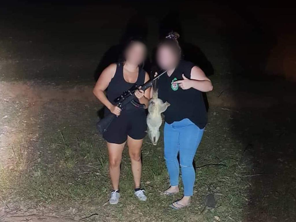 The two girls posing with a shot possum. Picture: RSPCA