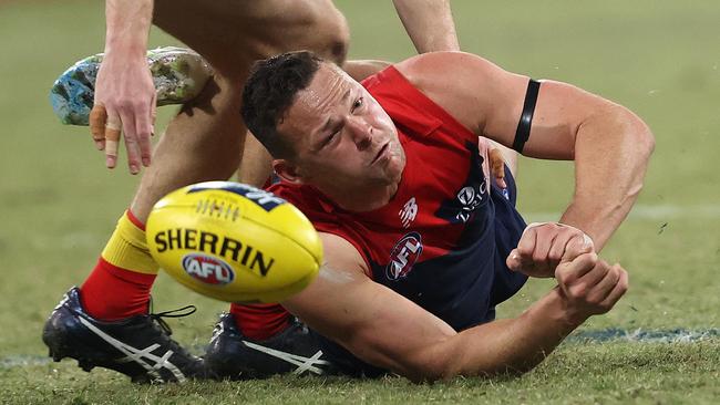 Melbourne’s Steven May gets a handball away. Picture: Phil Hillyard