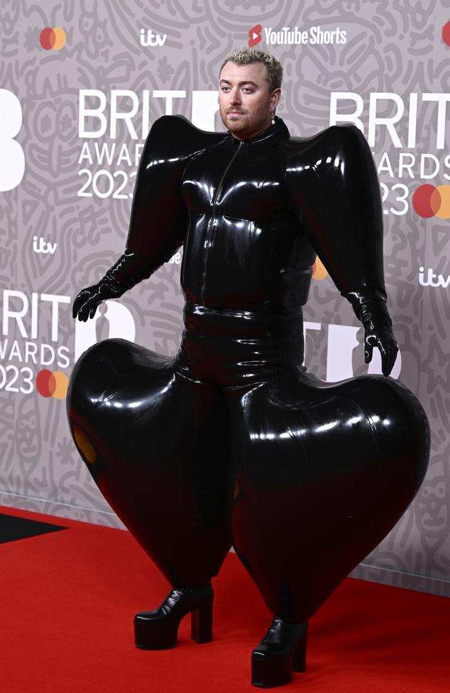 Sam earlier made a splash, walking the red carpet in this inflated latex outfit. Picture: Getty