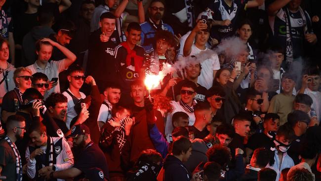 Fans set off flares during the round eight A-League Men's match between Melbourne City and Melbourne Victory at AAMI Park. Pic: Darrian Traynor/Getty Images