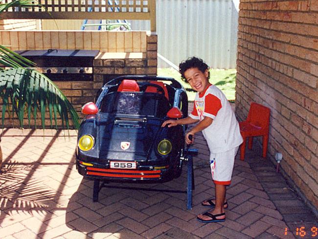 The youngster loved cars, even when he wasn’t behind the wheel.