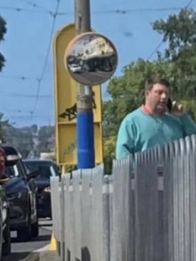 Disgraced politician Tim Smith was snapped by a driver waiting at a tram stop in Kew.