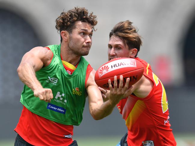 Jarrod Harbrow (L) and David Swallow of the Suns seen during a training session at the Adelaide Arena at Jiangwan Stadium in Shanghai, China, Thursday, May 17, 2018. (AAP Image/David Mariuz)