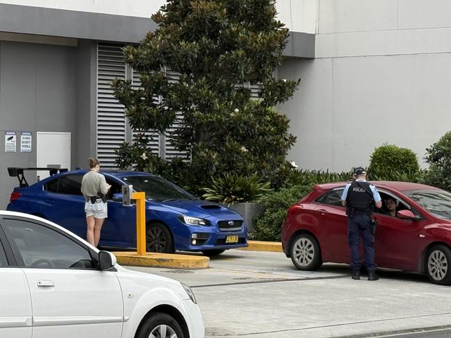 Police speak to residents of an apartment block in Parramatta after a woman fell to her death overnight. Picture: Supplied