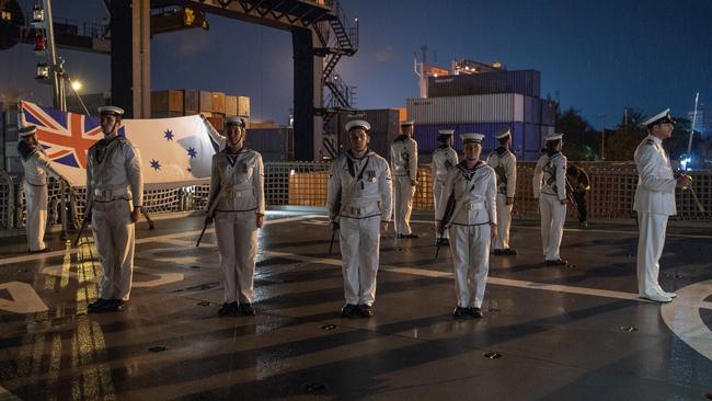 Trade containers loom as an RAN shipboard crew greets regional guests at a port sunset function in Makassar in Indonesia as part of Indo-Pacific Endeavour 2019. Picture: ADF