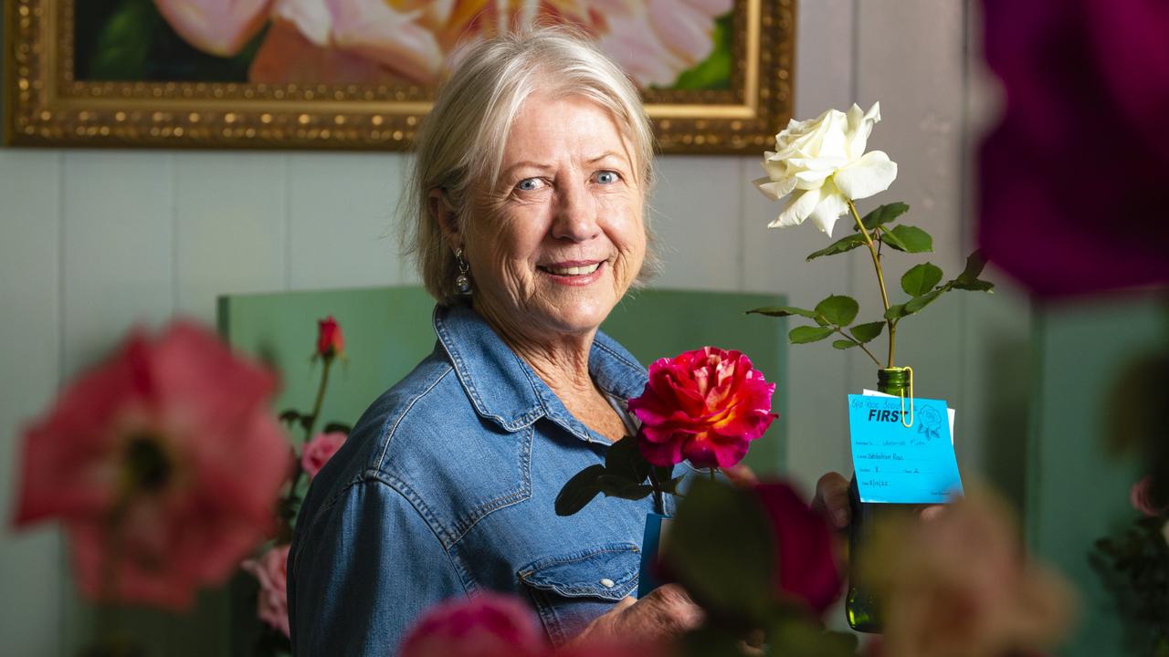 Veronica Firth with her winning entries in the 2022 Spring Champion Rose Show at the Rose Cottage in the Queensland State Rose Garden, Saturday, October 8, 2022. Picture: Kevin Farmer