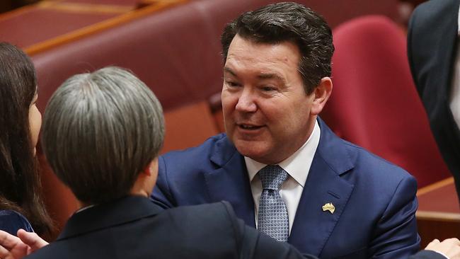 Labor Senator Penny Wong gets a hug from Liberal Senator Dean Smith after she spoke on the Marriage equality bill in the Senate. (Pic: Kym Smith)