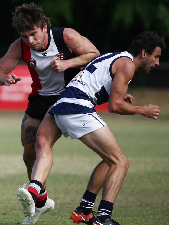 Crocs' Brett McKeown puts on a bump in the AFL Cairns Seniors match between the Cairns Saints and the Port Douglas Crocs, held at Griffiths Park, Manunda. PICTURE: BRENDAN RADKE