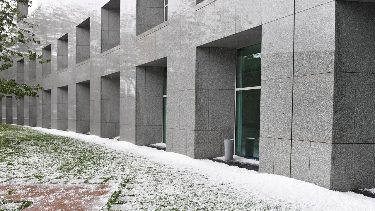 Golf ball size hail after a severe hail storm is seen at Parliament House in Canberra. Picture: AAP