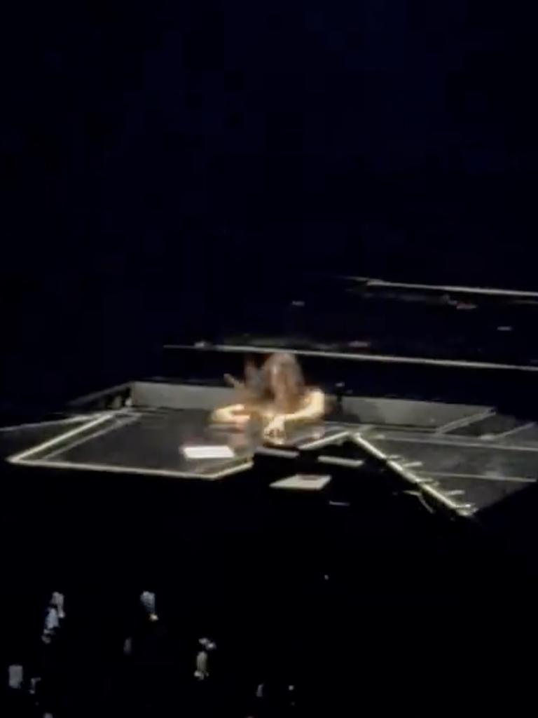 … when she abruptly fell through a hole in the stage. Picture: Twitter