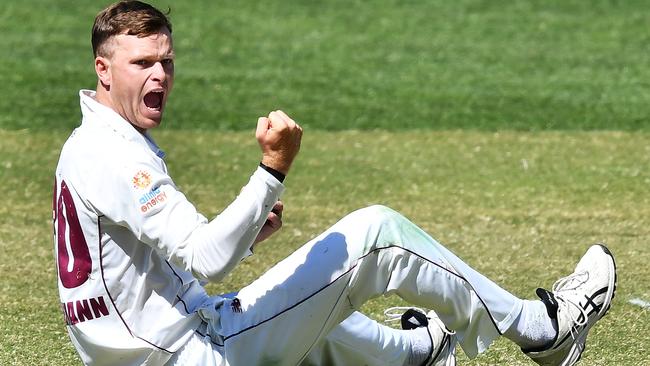 Matt Kuhnemann of the Queensland Bulls celebrates after catching the wicket of Jake Carder of the Redbacks. Photo: Mark Brake/Getty Images.