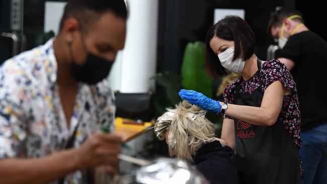 Hairdresser Heather colours a customer's hair … it takes way longer than 30 minutes. Picture: Dan Peled/AAP