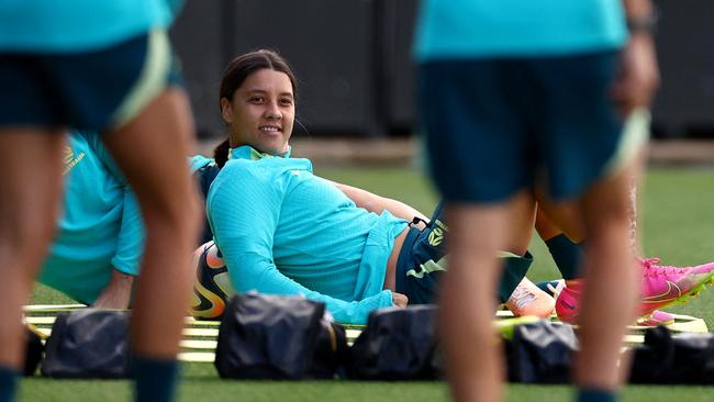 Australia's forward Sam Kerr stretches during a training session