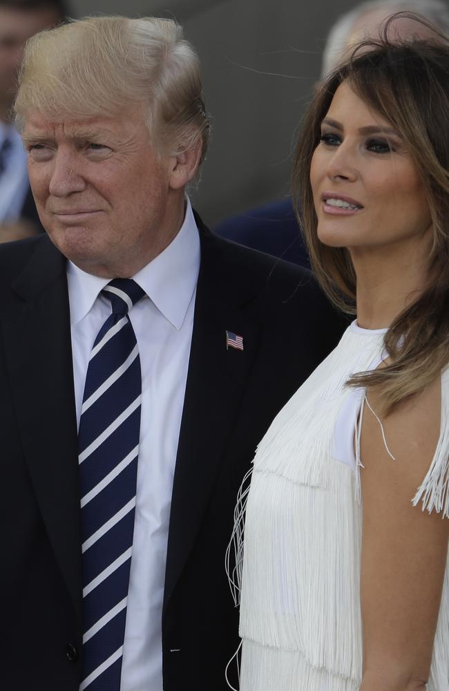 President Trump and First Lady Melania arrive after she was forced to spend the day inside due to protests. Picture: AP Photo/Markus Schreiber.