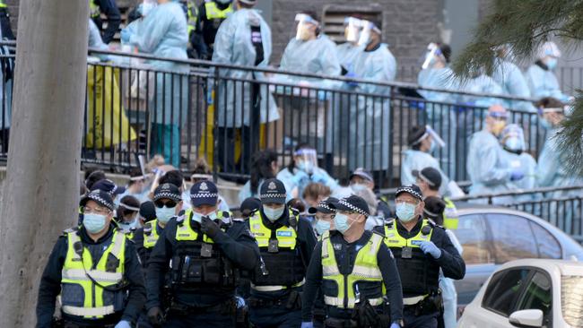 A large police contingent was deployed to patrol the towers. Picture: Andrew Henshaw