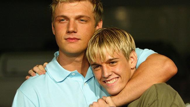 HOLLYWOOD, CA - APRIL 14:  Aaron and Nick Carter (L) aririve for the "Simple Life 2" Welcome Home Party at The Spider Club  on April 14, 2004 in Hollywood, California. (Photo by Frazer Harrison/Getty Images)