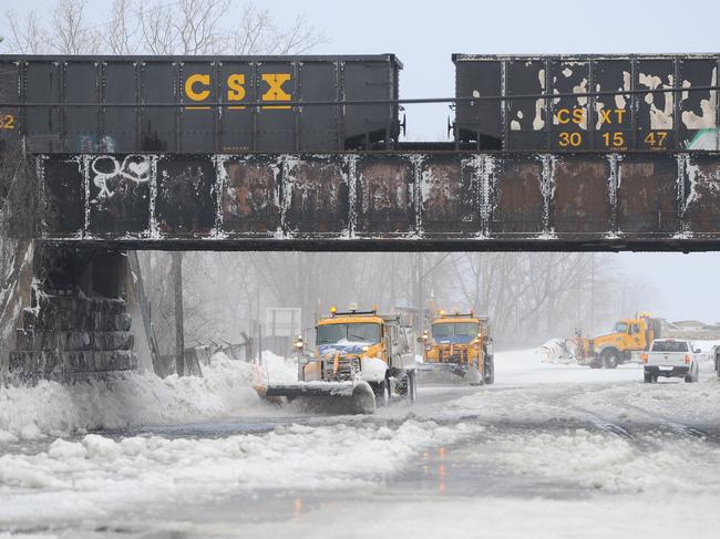 Ploughs work to clear ice and snow along the Lake Erie shoreline. Picture: John Normile/Getty Images