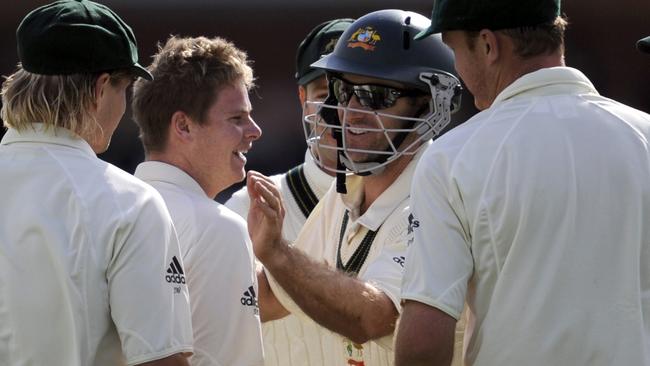 Steve Smith is congratulated after claiming a wicket on debut at Lord's against Pakistan in 2010.