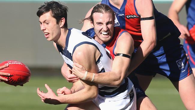 Keenan Posar wraps up Geelong’s Jack Henry. Picture: Glenn Ferguson